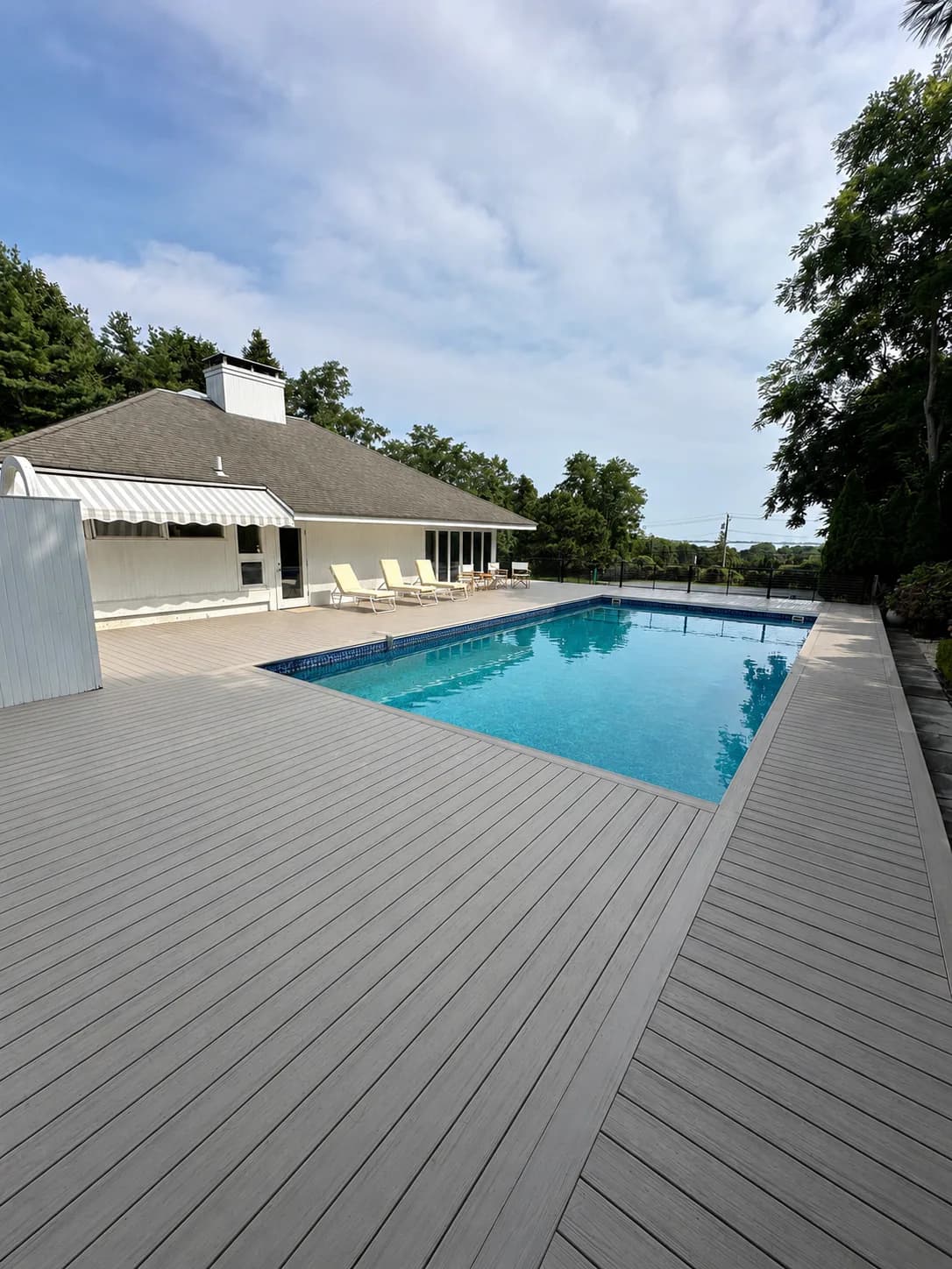 Composite pool deck built around an in-ground pool